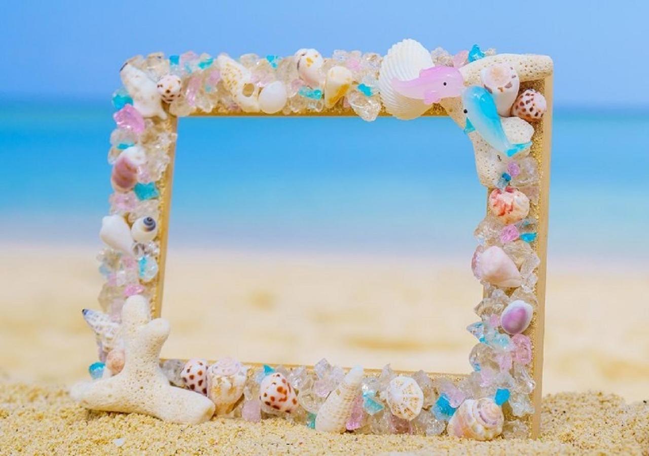 Hotel Monterey Okinawa Spa & Resort Onna Exterior photo A seashell frame